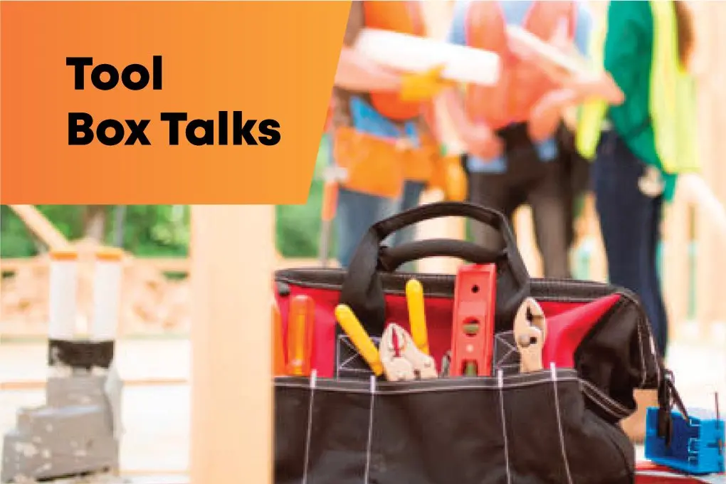 Construction workers participating in a 2-hour toolbox talk for site safety